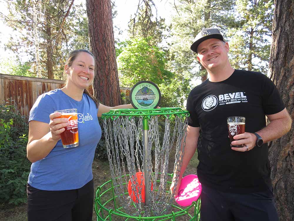 bevel brewing co-founder valeria and nate doss disc golf basket