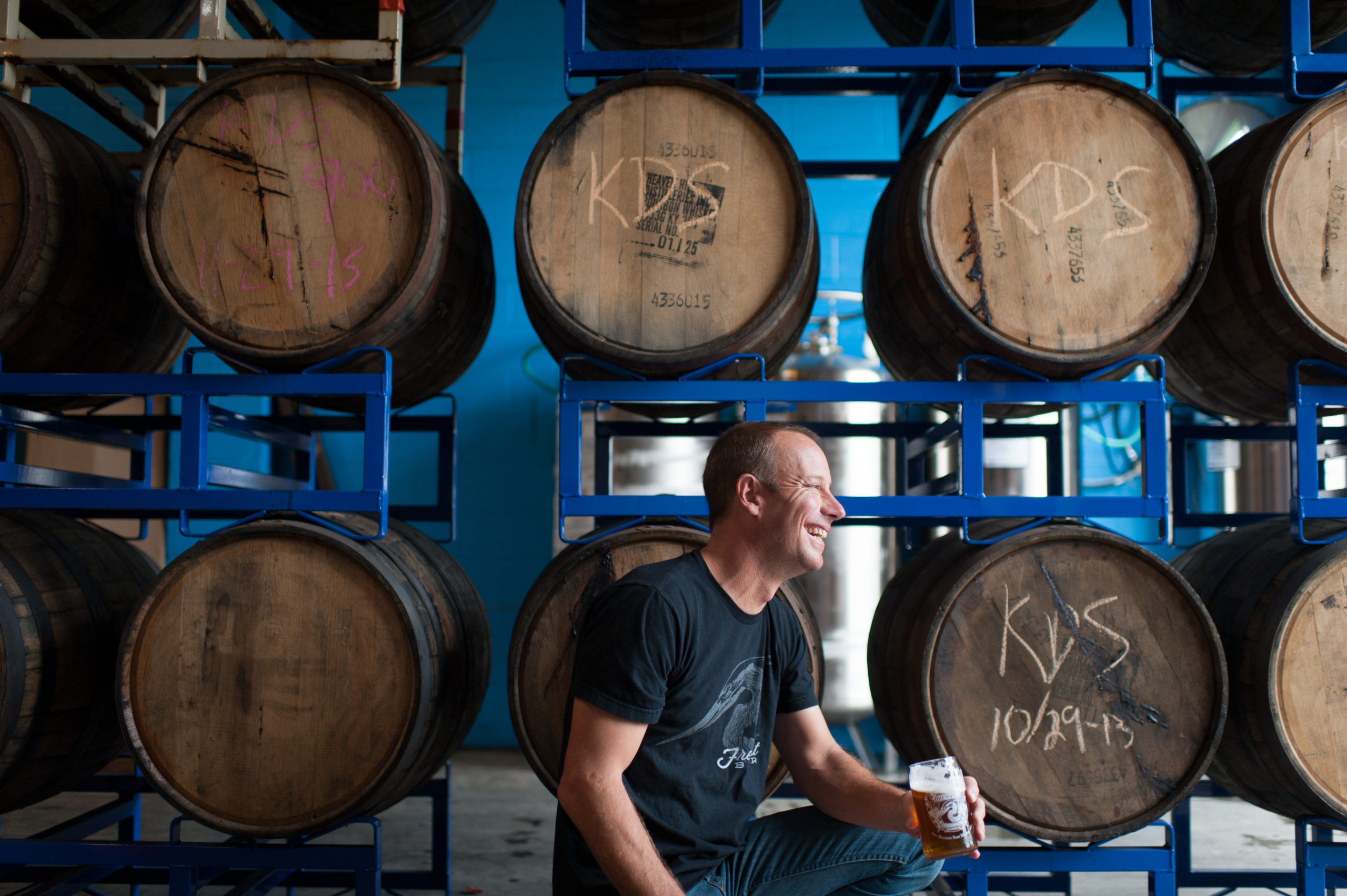 matt at fremont brewing in front of barrels