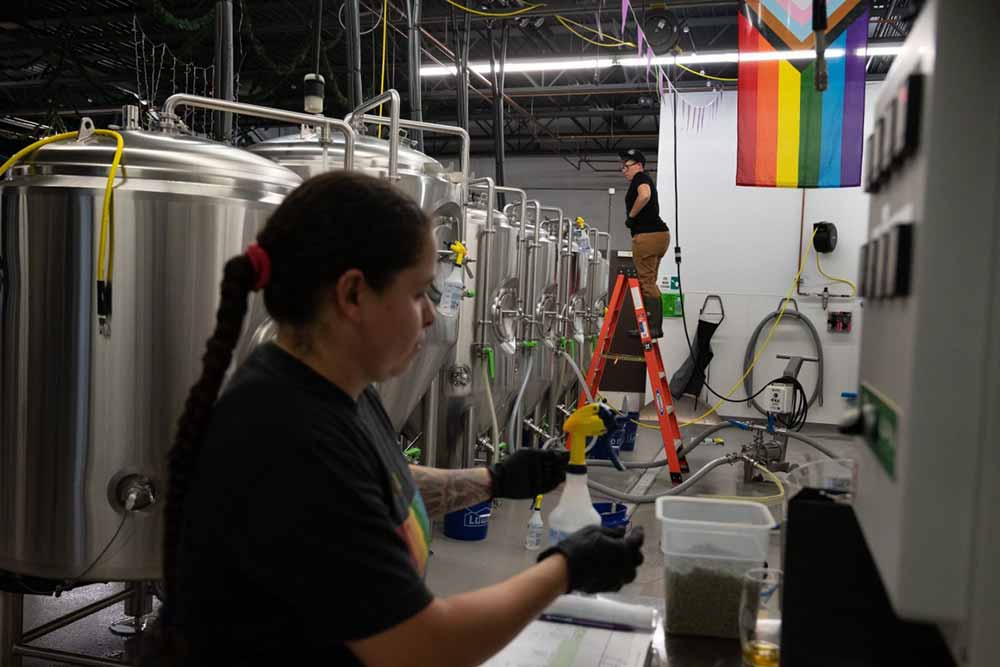 necromancer brewing head brewer lauren hughes and assistant brewer nina santiago