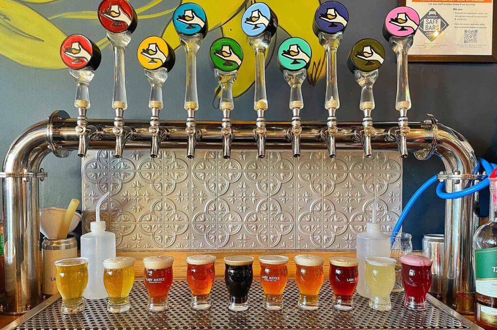 lady justice brewing company rainbow tap handles