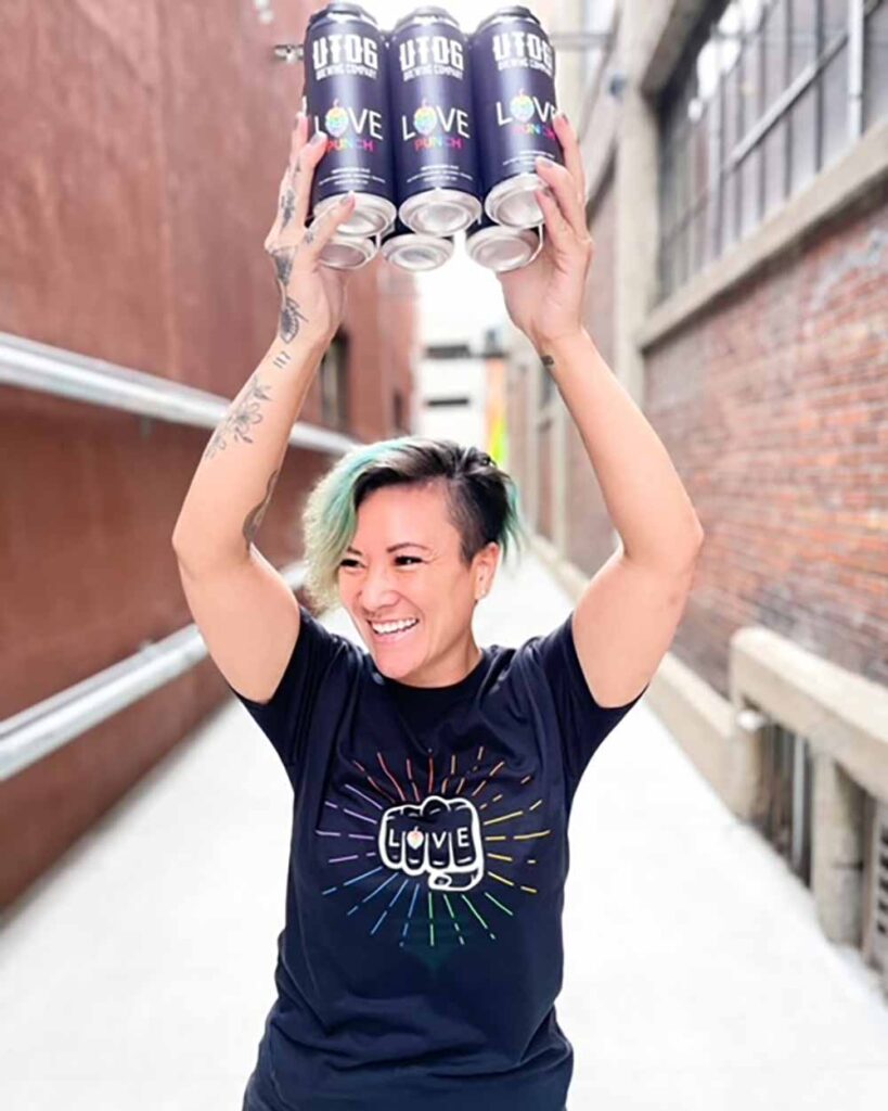 utog brewing sales and marketing director jazmin tom with love punch pride beer