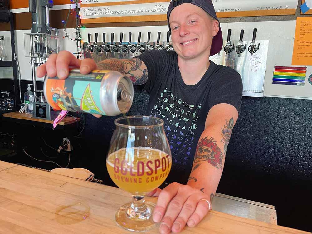 goldspot brewing company founder kelissa hieber pouring beer