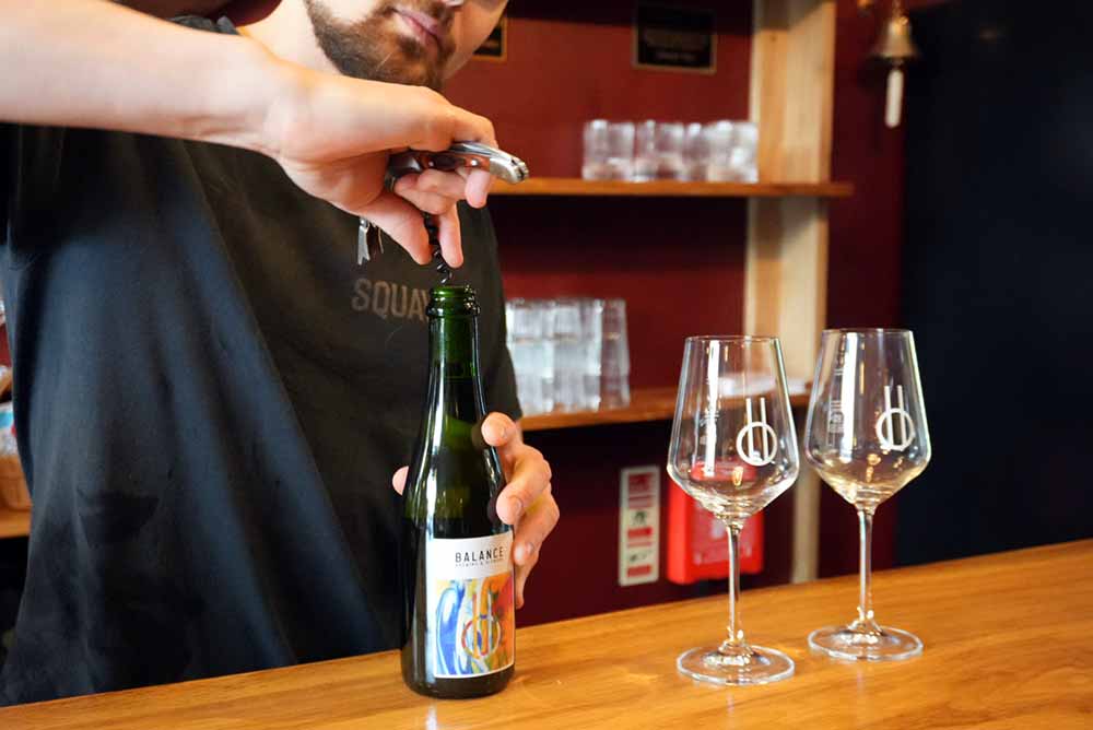 balance brewing and blending co-founder james horrok pouring table beer